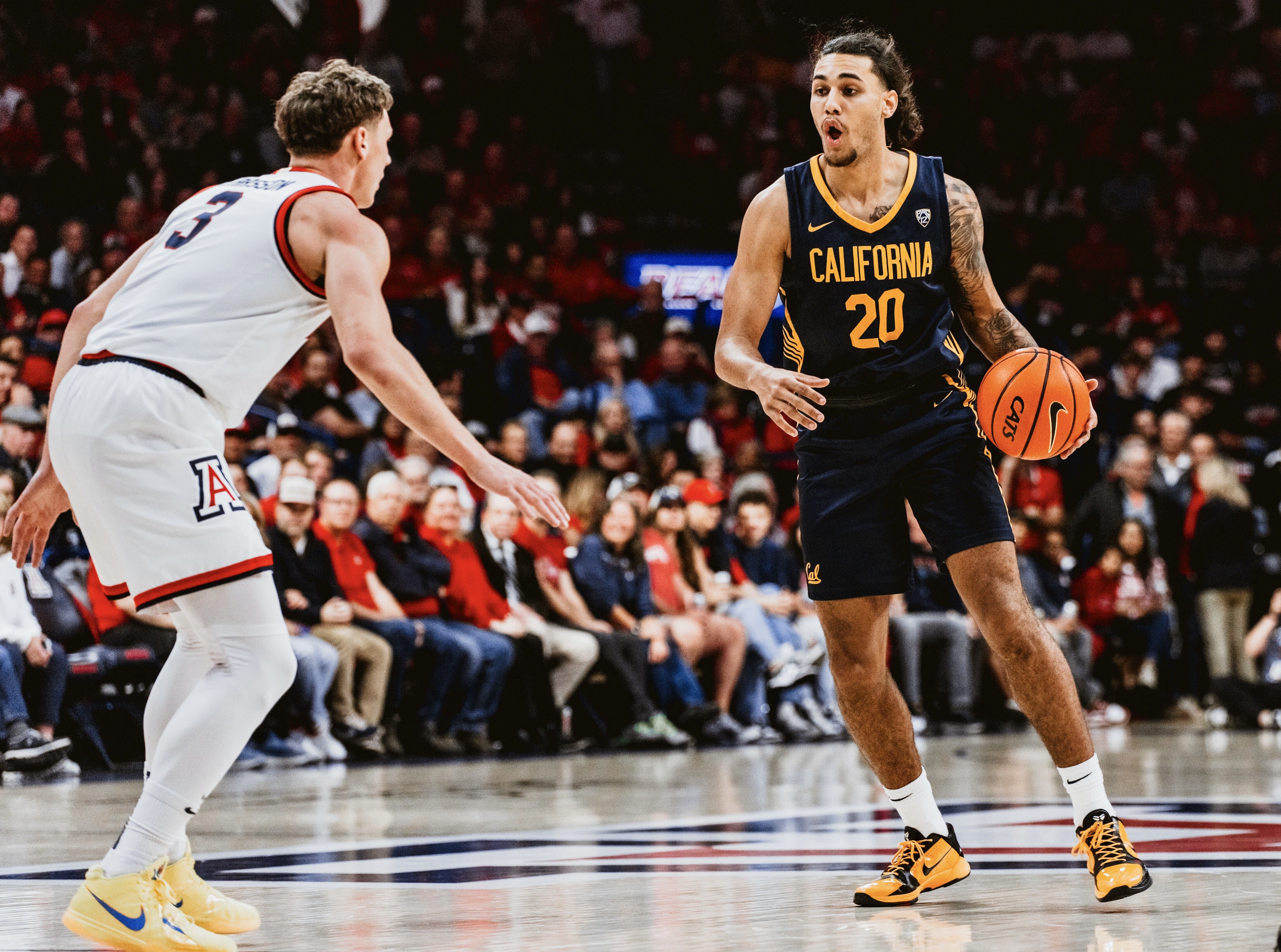 Jaylon Tyson looks for room to operate against Arizona.